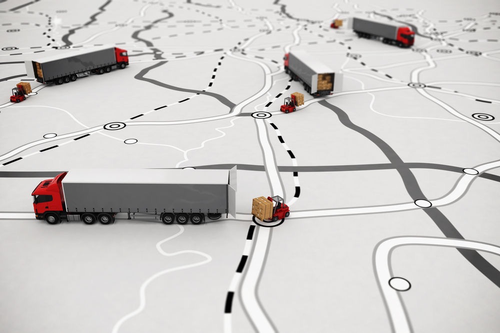 Model trucks on a hand-drawn map of routes, illustrating a coast-wide transport network.