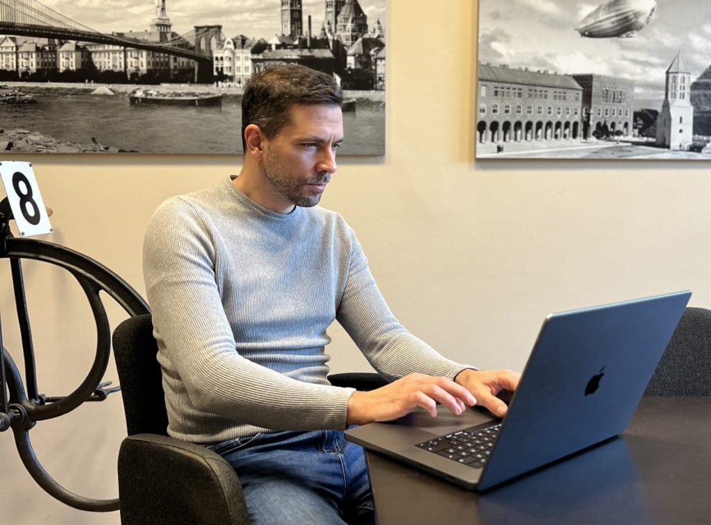 Smpl's head of dev, Andras Toth, working at his desk